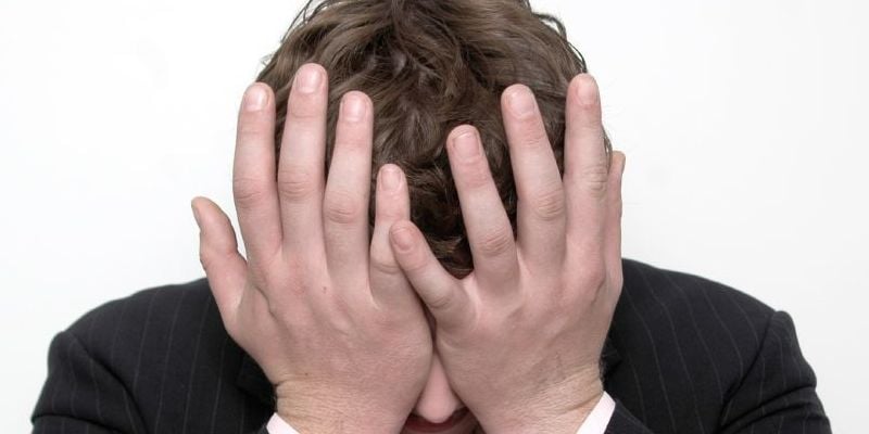 Man engaging in a double faceplam